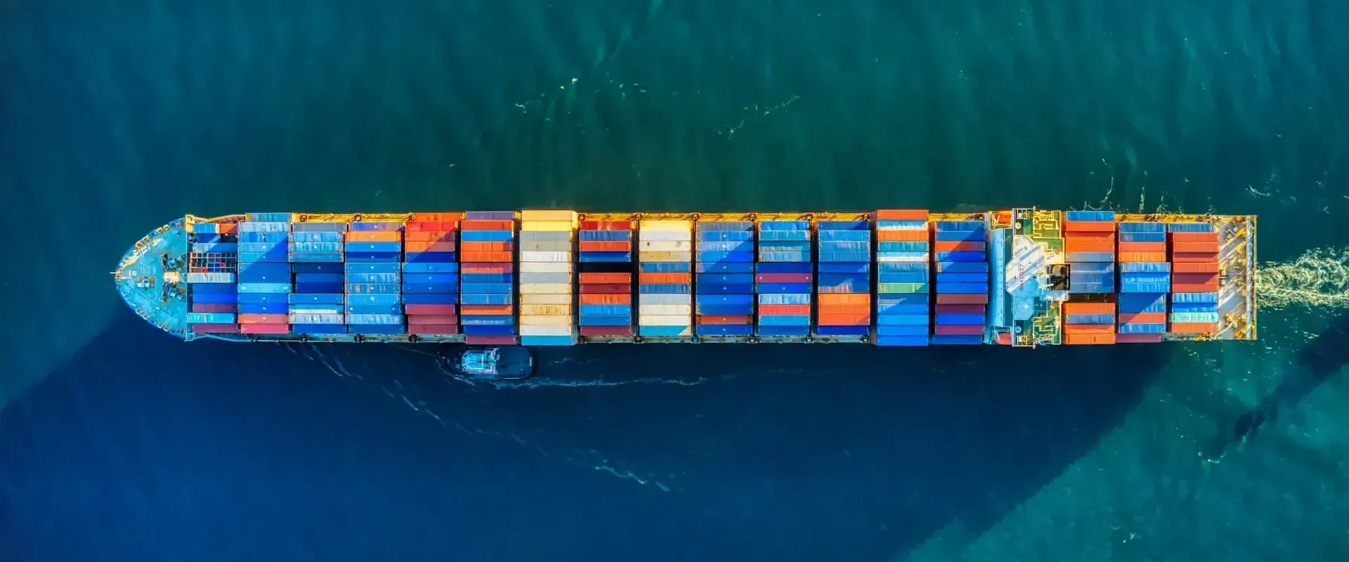 Aerial view of a cargo ship loaded with shipping containers